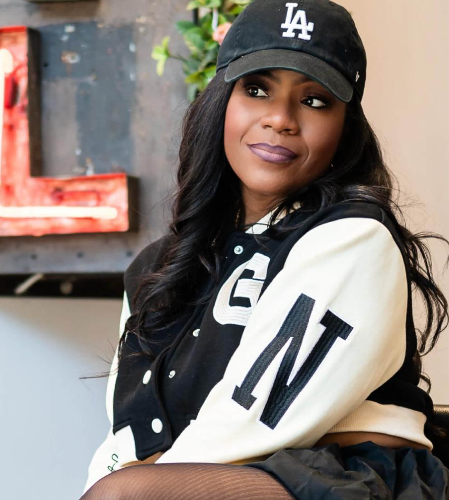 Photo of Jessica Fitzgerald of Pretty Classy Beauty in a hat and jacket.